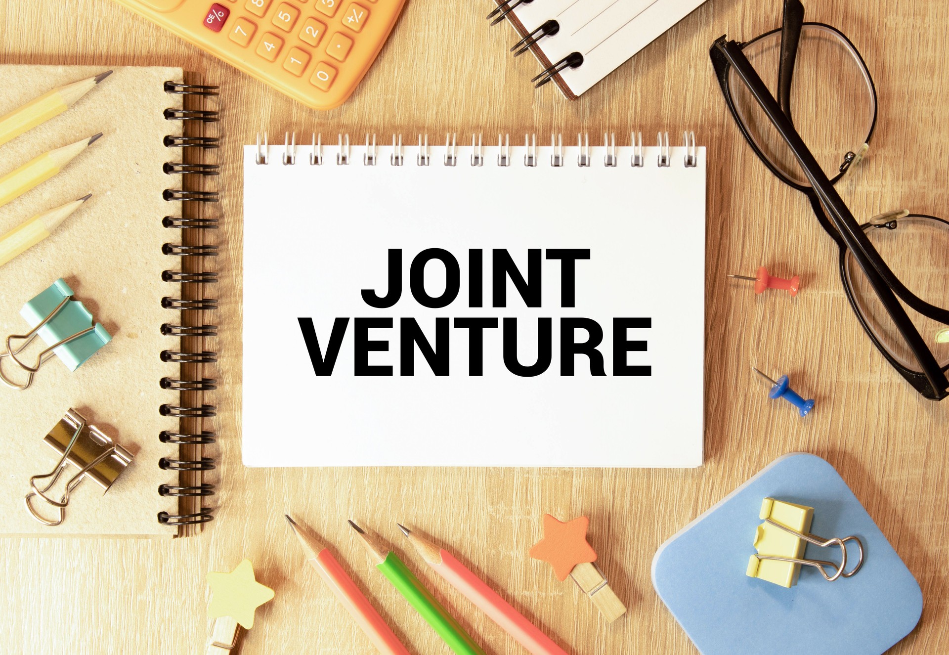 Handwriting text writing Joint Venture. Concept meaning Collaboration Arrangement Parties Partnership Team